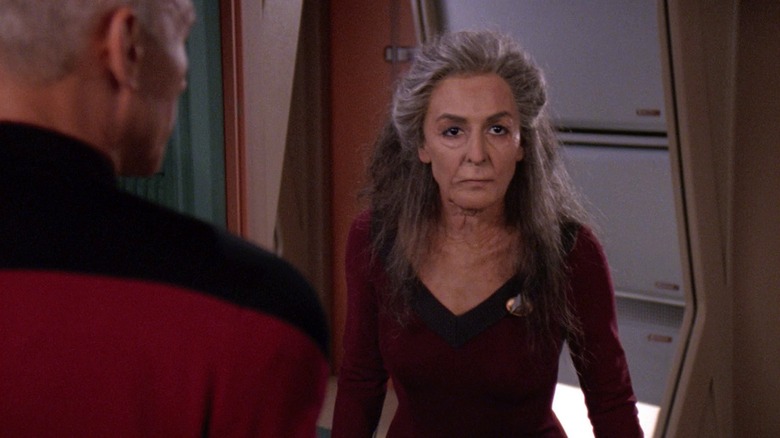 Deanna Troil standing before Picard in Star Trek: The Next Generation