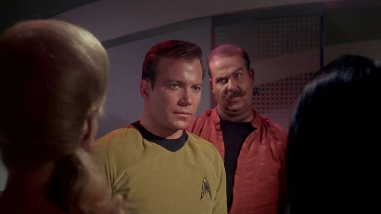Captain Kirk looking at women while Harry Mudd observes on Star Trek: The Original Series