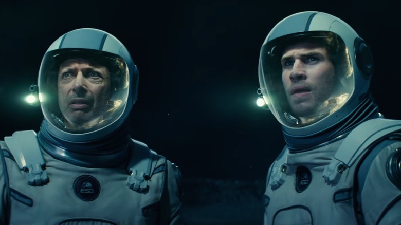 David Levinson and Jake Morrison walk in space suits in 