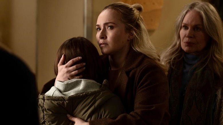 Sarah holding her child in Sleepwalker (2026)