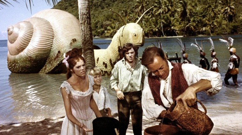 Doctor Dolittle and friends tend to a giant snail in Doctor Dolittle (1967)