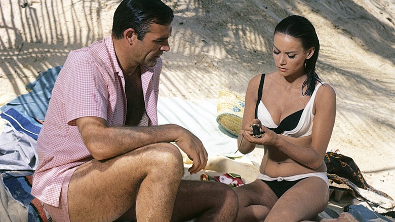 James Bond inspecting a gadget in Thunderball (1965)
