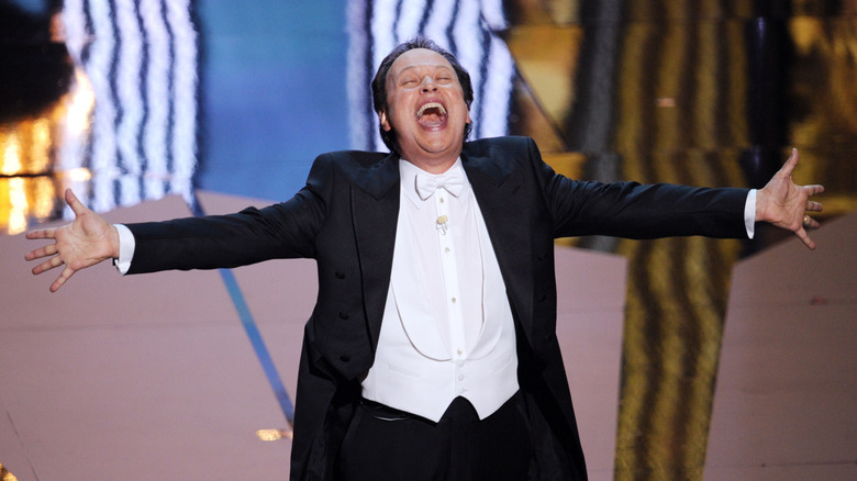 Billy Crystal outstretch his hands at the 84th Academy Awards (2012)