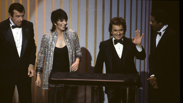 The four hosts of the 55th Academy Awards during the show (1983)