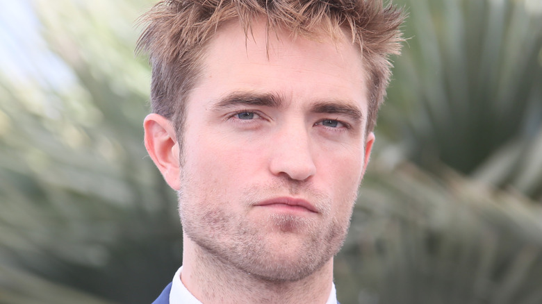 Robert Pattinson squinting at camera