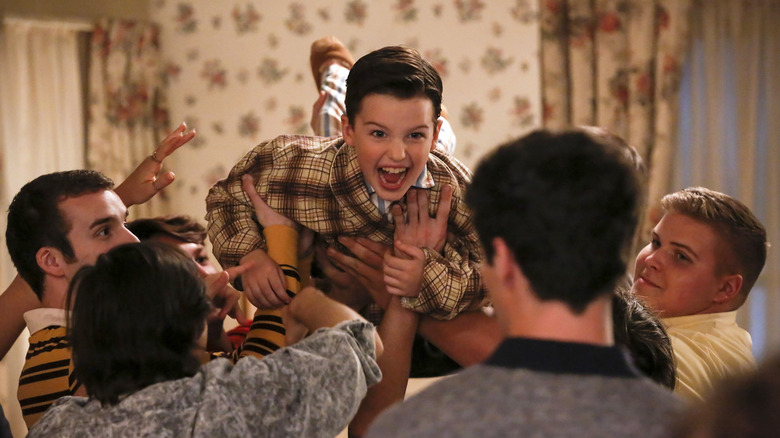 Sheldon crowd-surfs at a frat party in Young Sheldon
