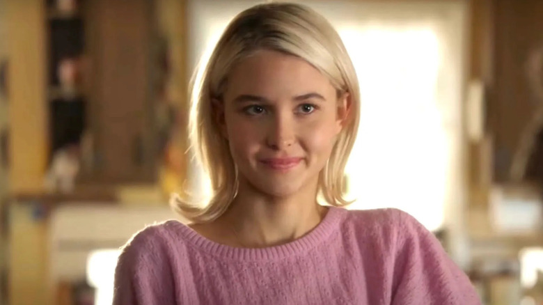 Veronica, wearing a pink sweater and smiling in Young Sheldon