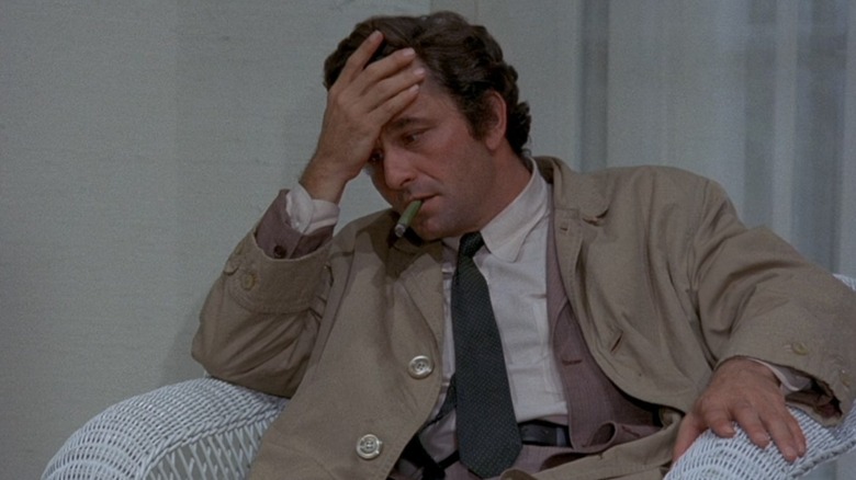Columbo ruminates on a case and smokes his signature cigar in "Columbo" (1968-2003)