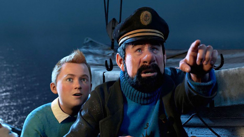 Tintin and Captain Haddock spot something in the distance in The Adventures of Tintin (2011)
