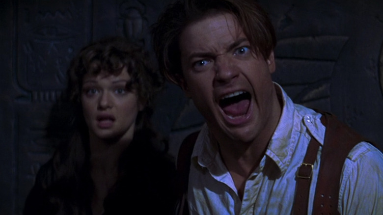 Rick O'Connell screams while Evelyn Carnahan looks on in The Mummy (1999)