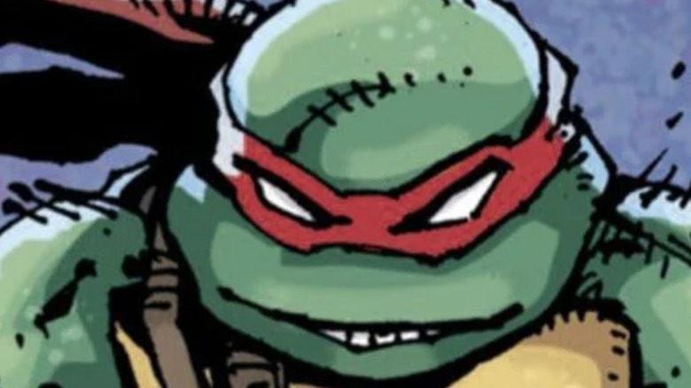 Raphael grinning in close-up