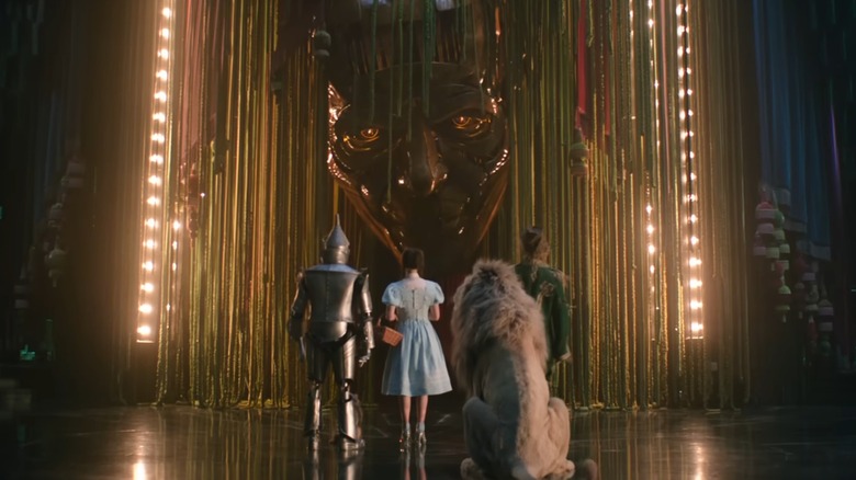 Dorothy, Scarecrow, Tin Man, and the Cowardly Lion in front of the Wizard in "Wicked: For Good" (2025)