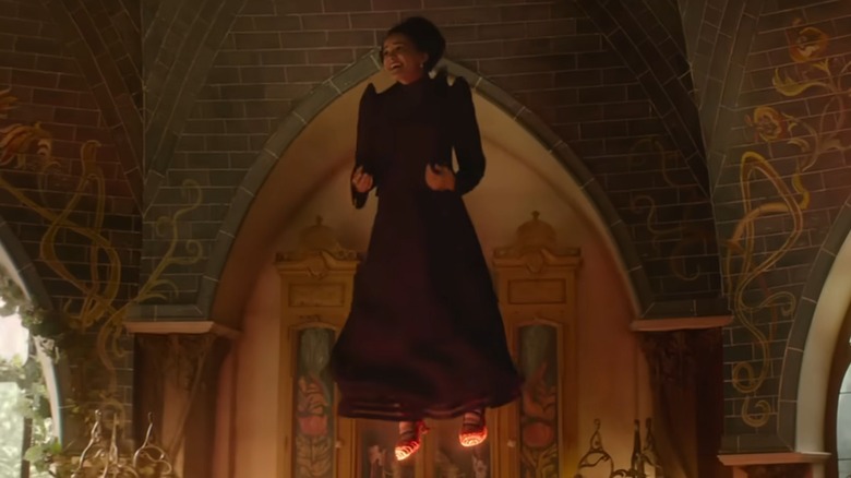 Nessa flying with red shoes in "Wicked: For Good" (2025)