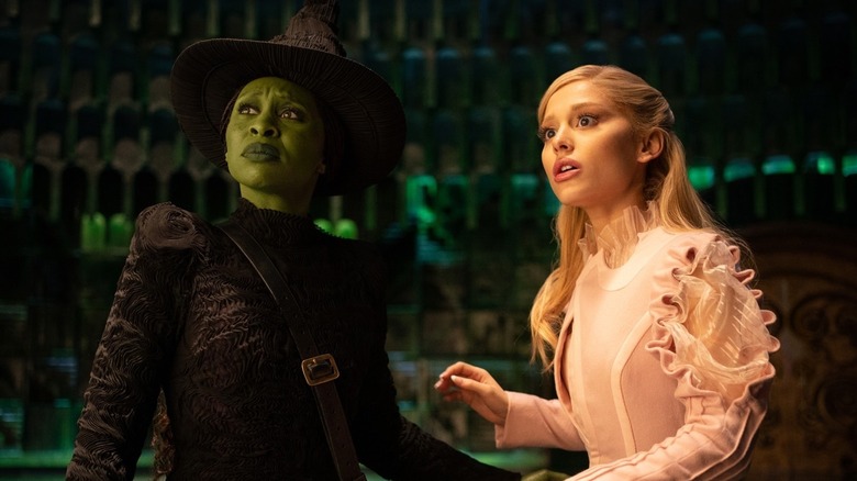 Elphaba and Galinda looking concerned in "Wicked" (2024)