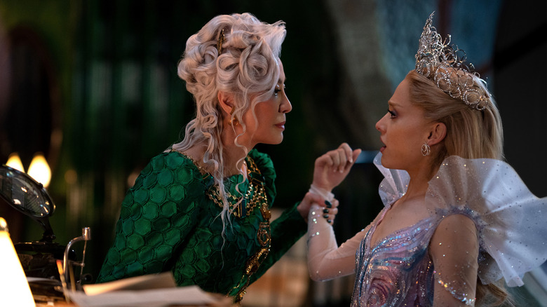 Madame Morrible holding Glinda by the wrist in "Wicked: For Good" (2025)