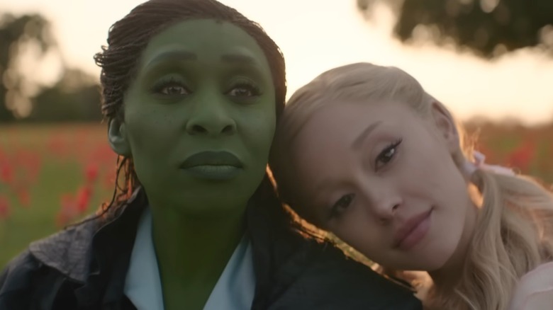 Elphaba and Glinda sitting together in "Wicked: For Good" (2025)