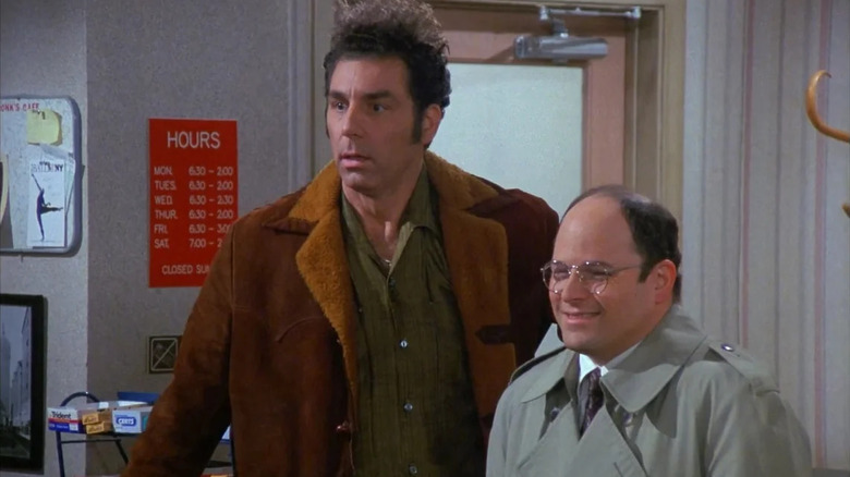 Michael Richards as Kramer and Jason Alexander as George Costanza share shock and laughter in Seinfeld.
