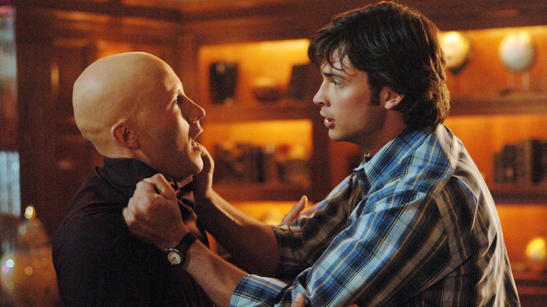 Clark Kent holding Lex Luthor by collar in Smallville