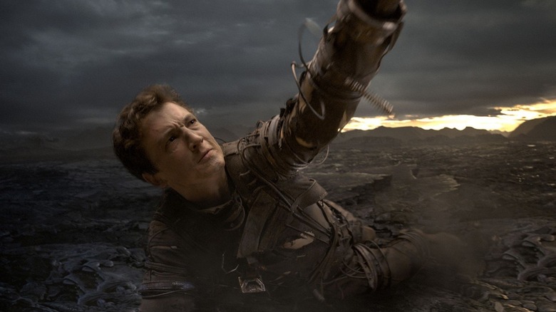Reed Richards stretches out his arm in "Fantastic Four" (2015)