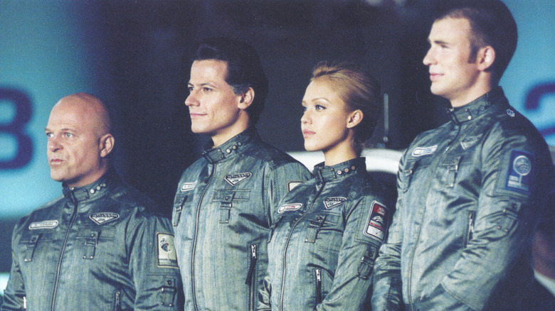 Ben Grimm, Reed Richards, Sue Storm, and Johnny Storm standing at attention in spacesuits (2005)
