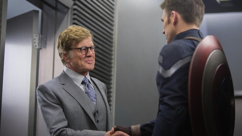 Alexander Pierce shakes hands with Steve Rogers in "Captain America: The Winter Soldier" (2014)