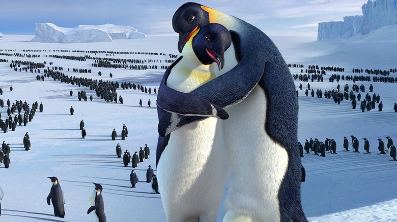two penguins hugging