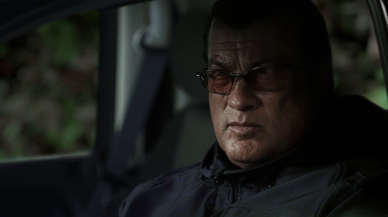 Seagal sitting in car
