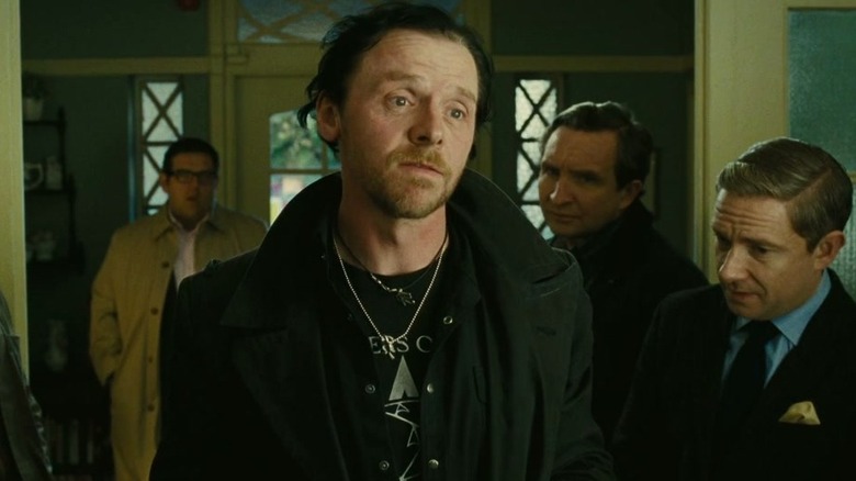 Gary shrugs with his friends behind him in The World's End (2013)