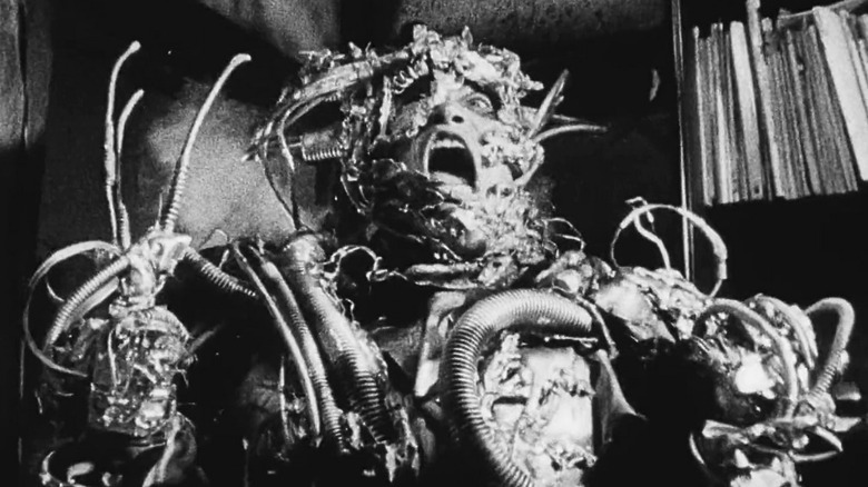 A cyborg screams in agony in Tetsuo: The Iron Man