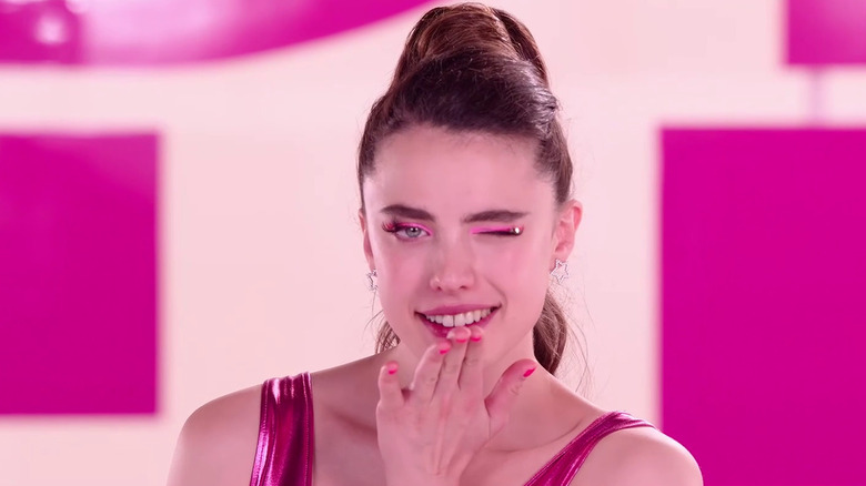 Sue winks and blows a kiss to the camera in The Substance