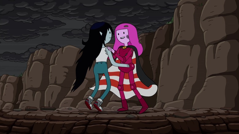 Marceline and Bubblegum embrace by cliffs in "Adventure Time"