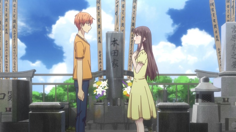 Kyo and Tohru stand at her mom's grave in "Fruits Basket"