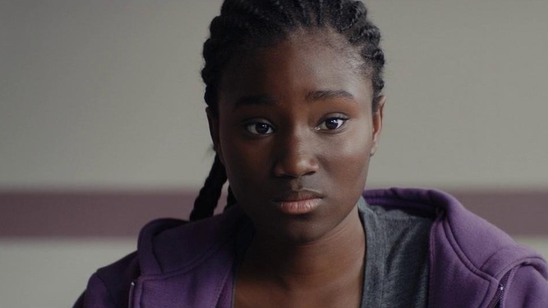Marieme listens intently in "Girlhood" (2014)