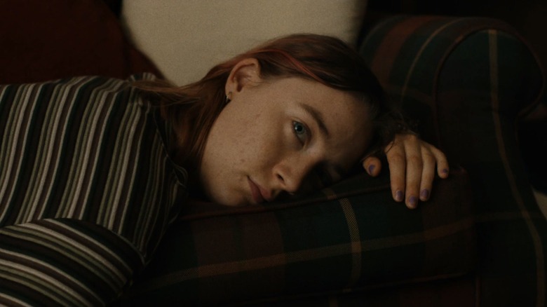 Lady Bird lounging on a couch in "Lady Bird" (2017)