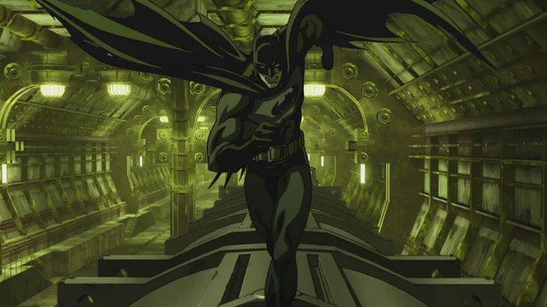 Batman runs on top of a subway train in Batman: Gotham Knight (2008)