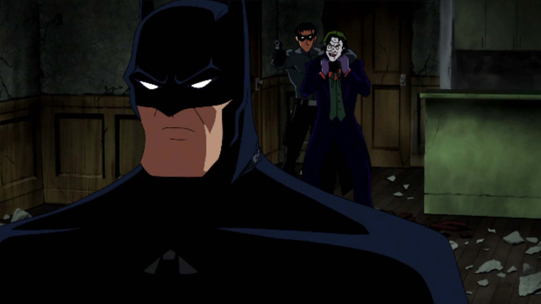 Batman walks away from Jason Todd and the Joker in Batman: Under the Red Hood (2010)