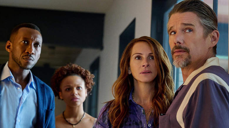 Ruth, G.H., Amanda, and Clay look concerned in "Leave the World Behind" (2023)