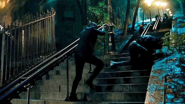 John Wick fights his way up the staircase in "John Wick: Chapter 4" (2023)