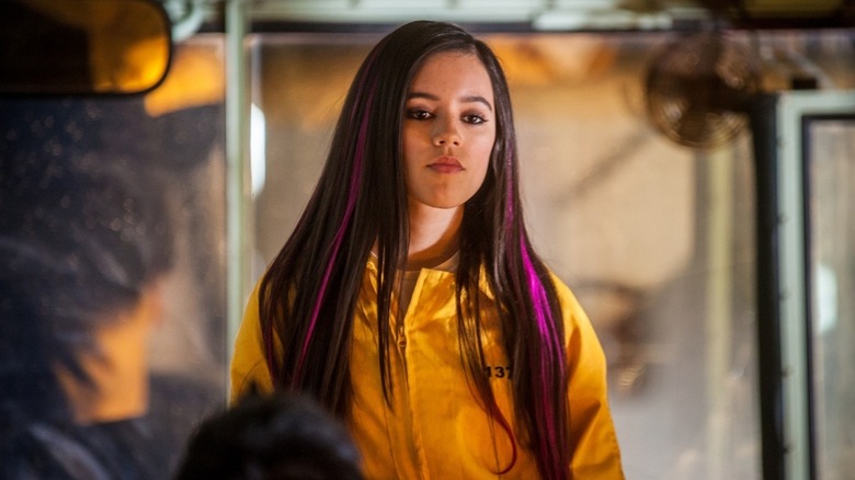 Camila in jumpsuit in American Carnage
