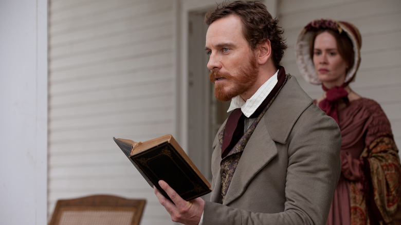 Edwin Epps holding book on porch in 12 Years a Slave