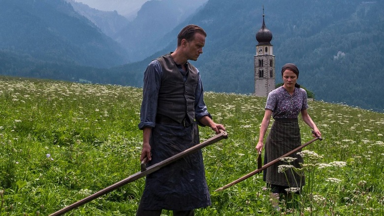 ﻿﻿Franz Jägerstätter and his wife tend to the fields in "A Hidden Life" (2019)