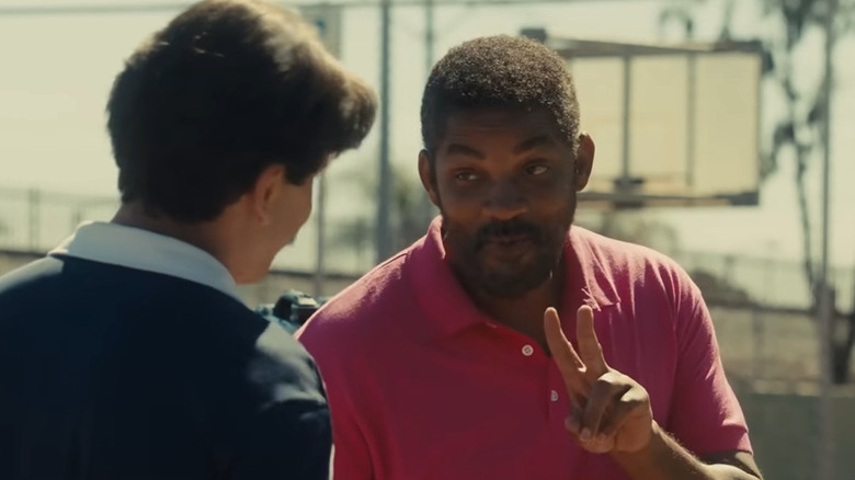 Richard Williams talking to his daughters' potential coach, rick Macci (Jon Bernthal) in King Richard