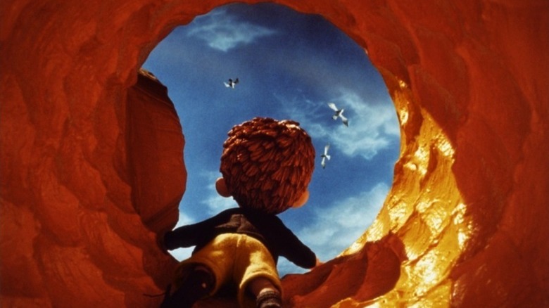 James peering out the top of the peach in James and the Giant Peach