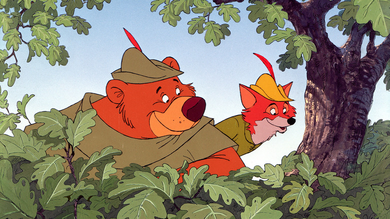 Robin and Little John peering through bushes in Robin Hood