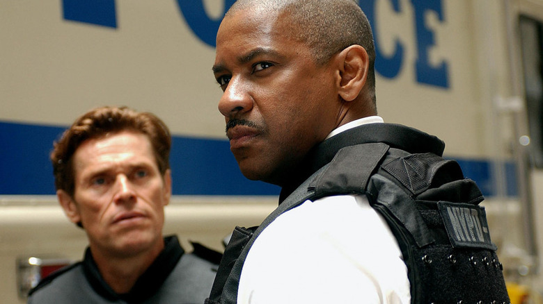 Darius looks at a scowling Frazier in "Inside Man" (2006)