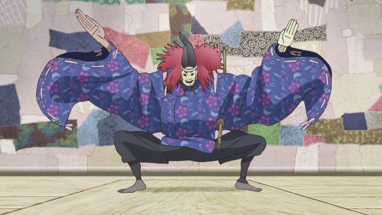 Inu-Oh wearing mask and costume for Noh theater in "Inu-Oh"