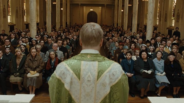 Priest addresses crowd