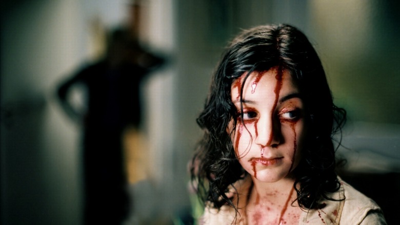 Eli covered in blood in "Let the Right One In" (2008)