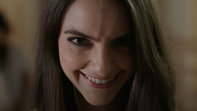 Caitlin Stasey smiling creepily