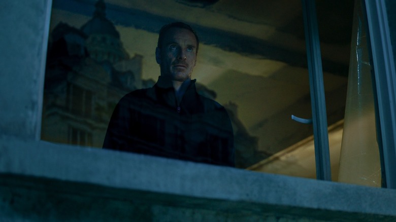 The Killer stakes out a Paris location in "The Killer" (2023)